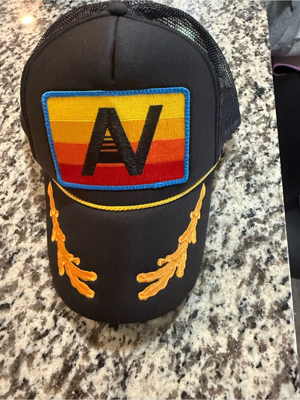 Aviator nation Black Trucker Hat with Multi-Color Patch and Gold Embroidery